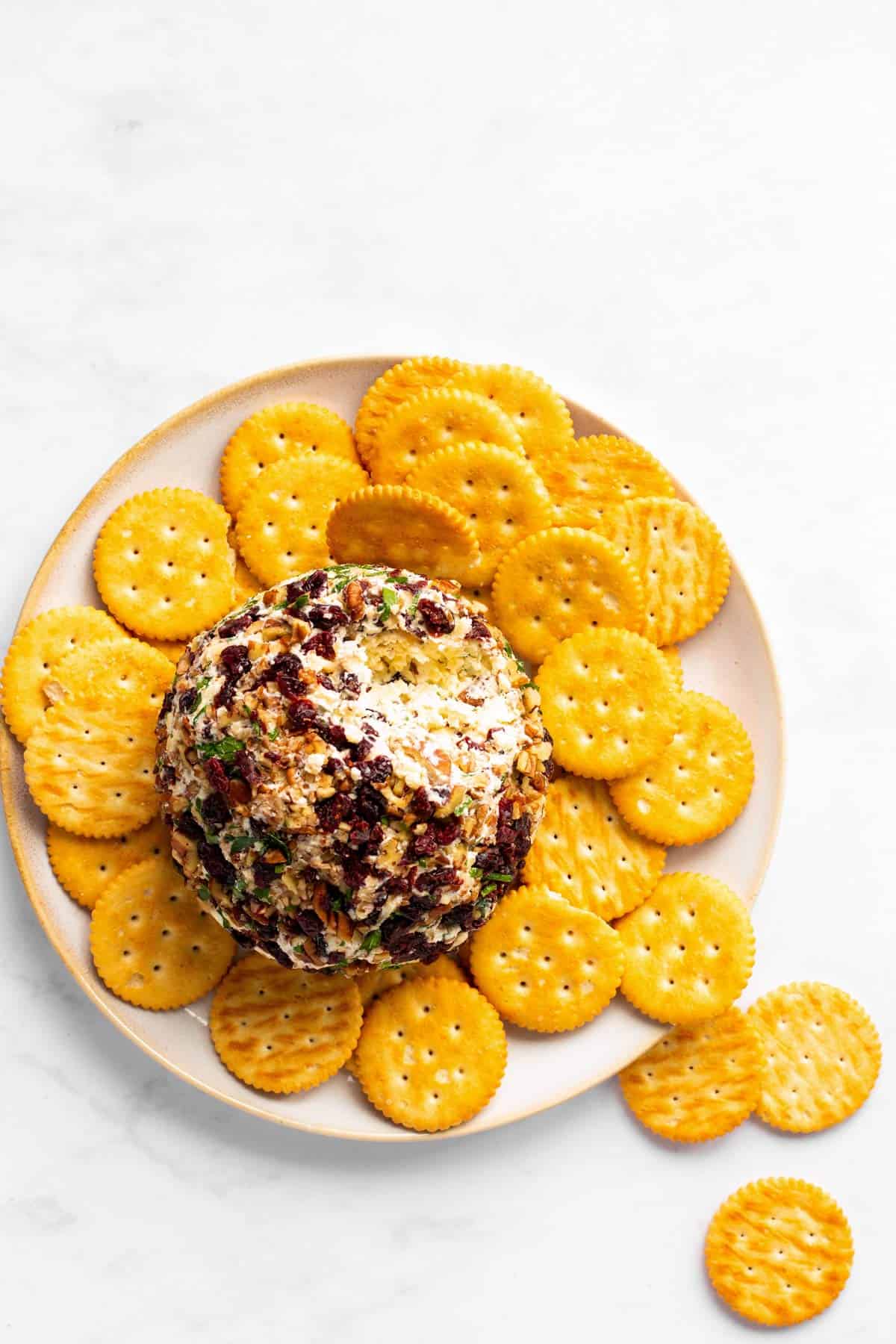 overhead view of platter with crackers and cheeseball