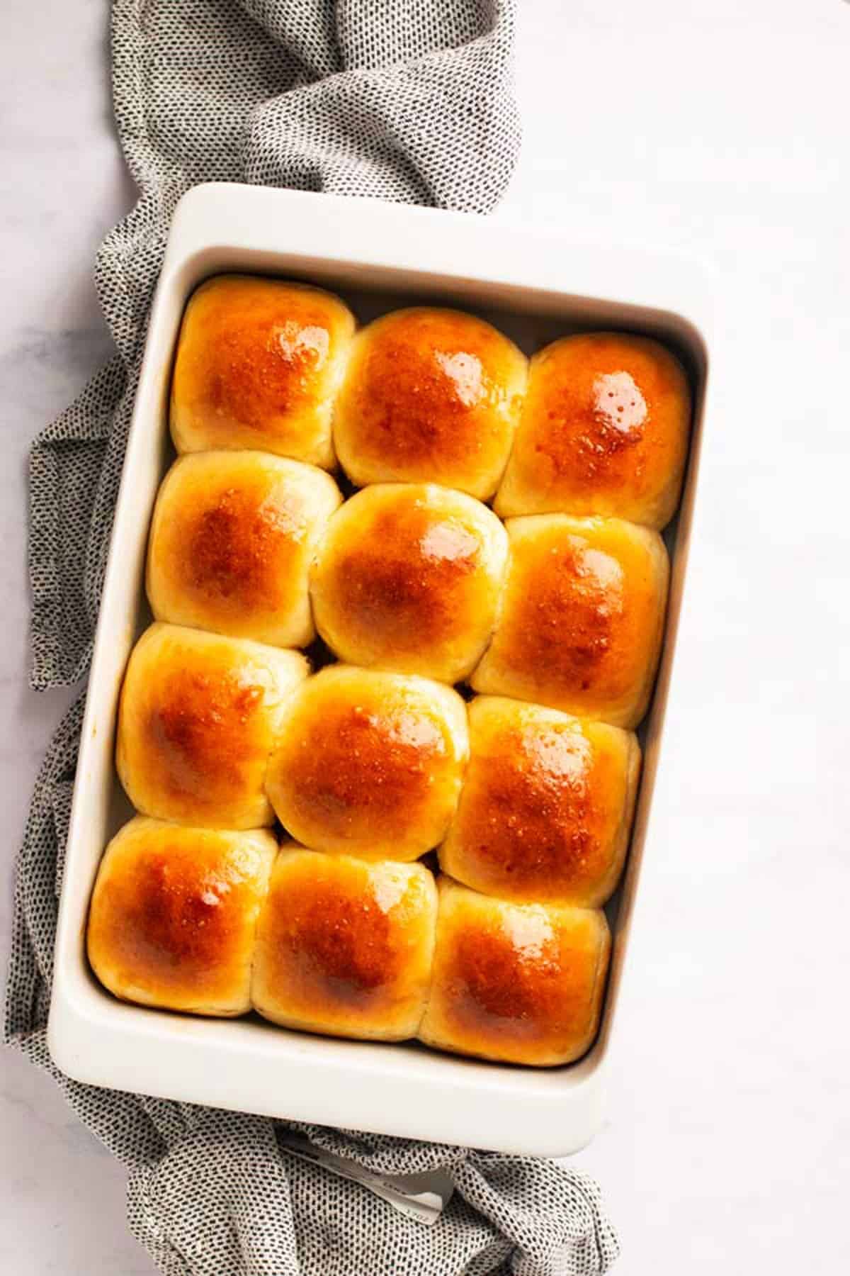baked dinner rolls in a white dish