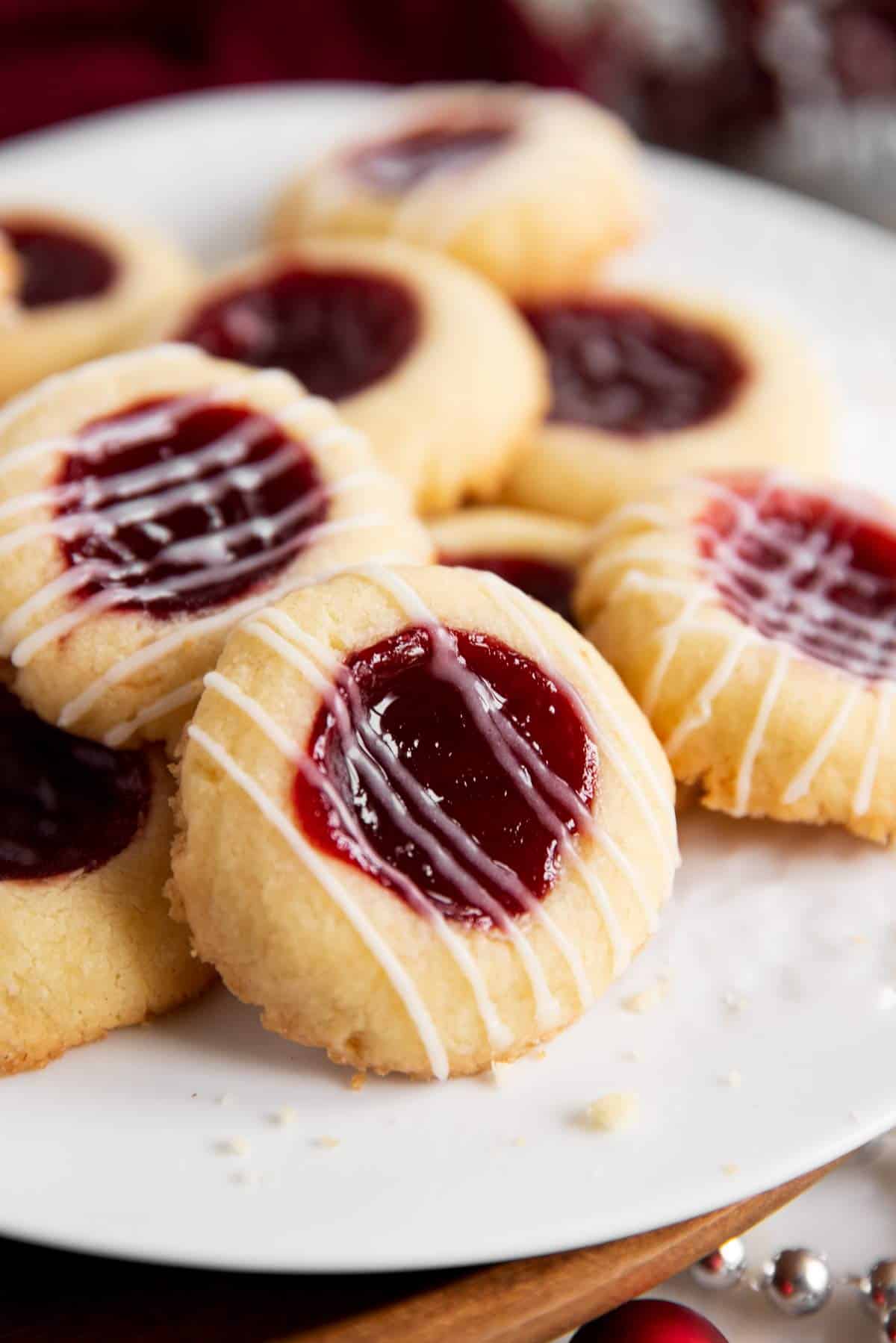 frontal view of thumbprint cookies on white plate