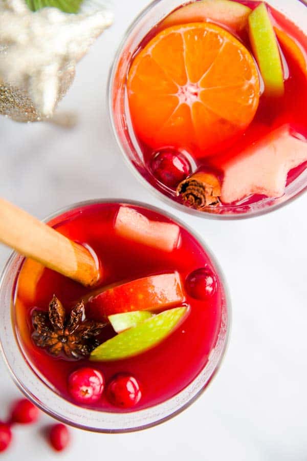 two glasses of Christmas punch on a marble surface