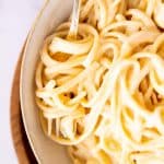 close up view of a bowl with fettuccine alfredo