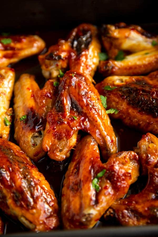 close up photo of sticky glazed chicken wings