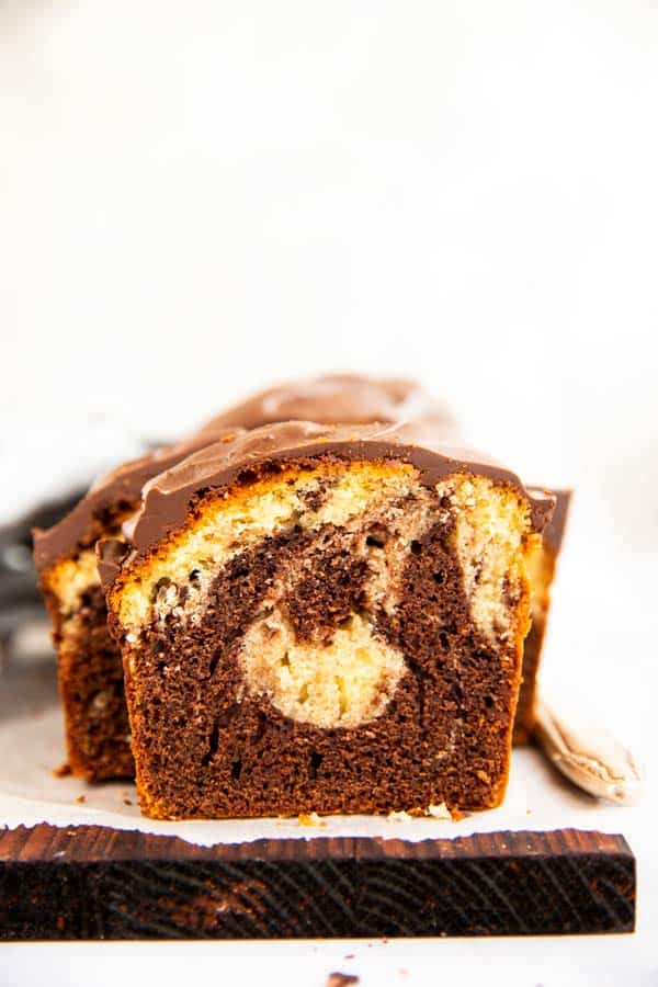 slice of marble pound cake on a wooden board