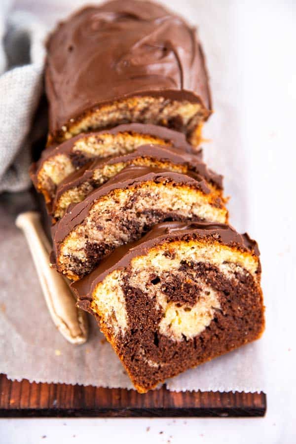 sliced marble pound cake on a wooden board