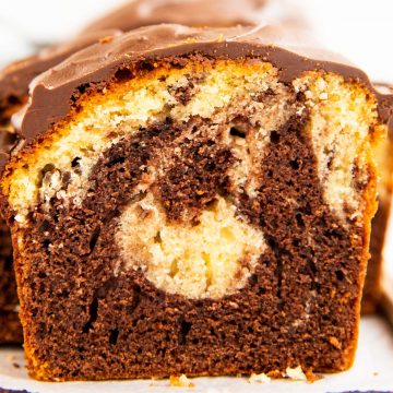 slice of marble pound cake on a wooden board