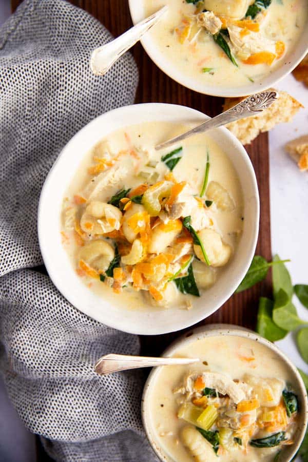 three bowls with Olive Garden copycat chicken gnocchi soup