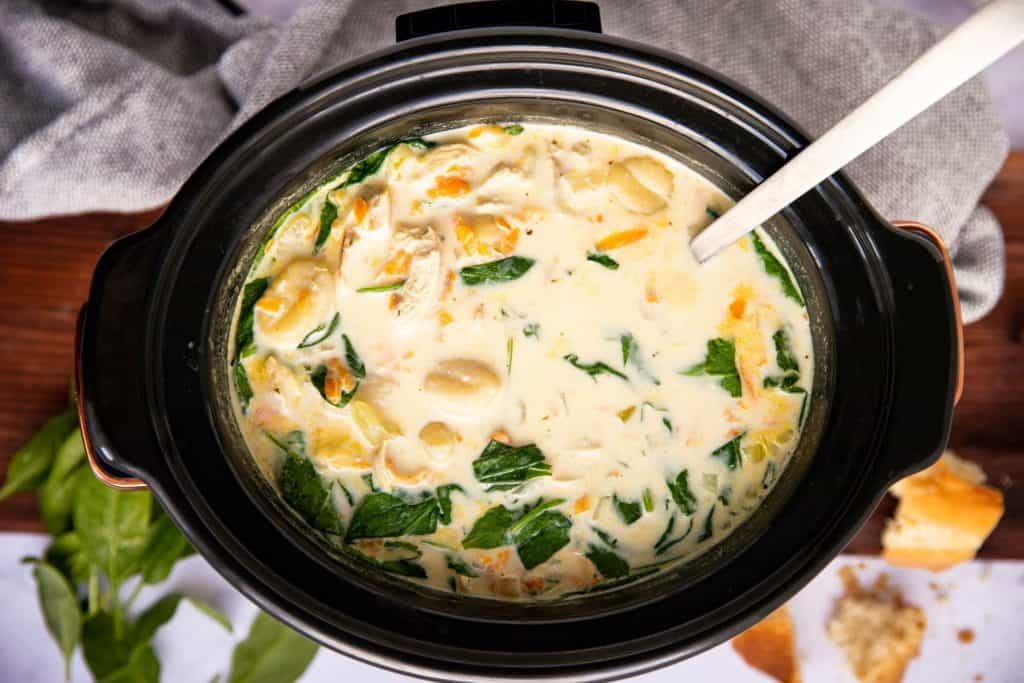 top down view on a black crock filled with creamy soup