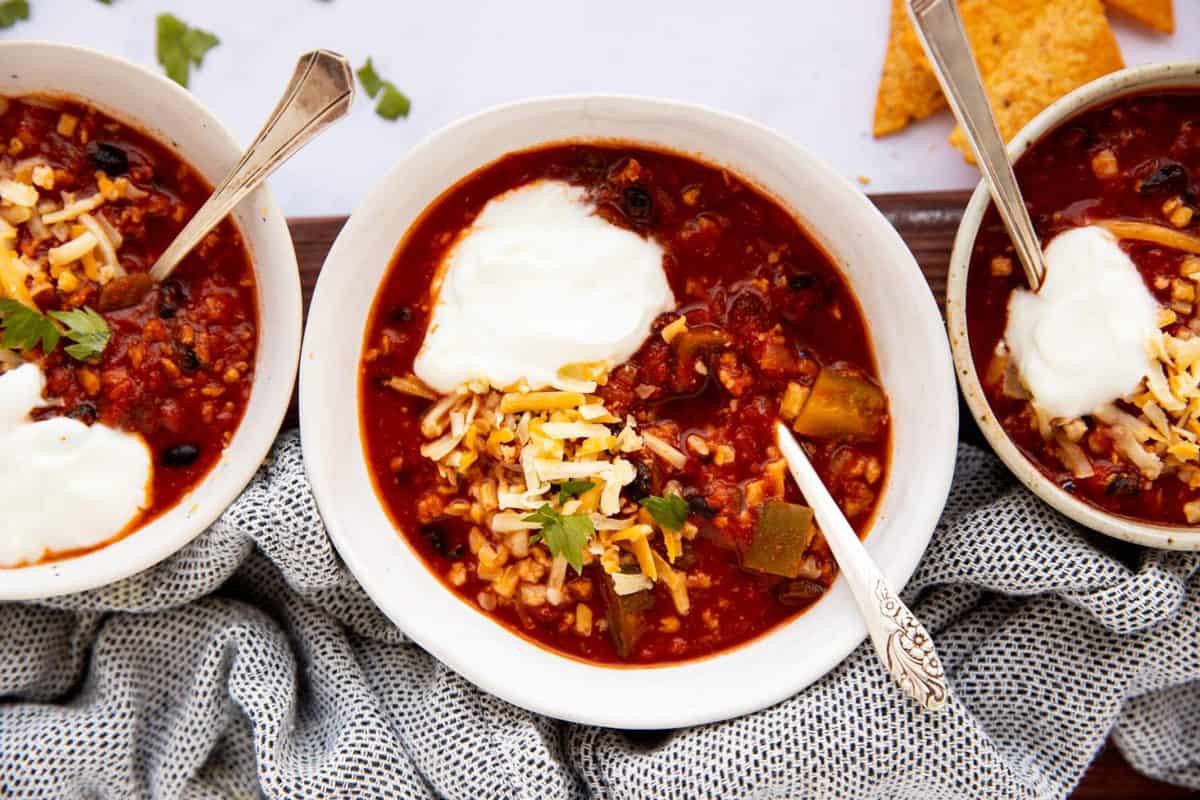 three bowls of turkey chili from the top down