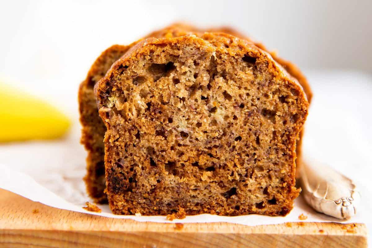 banana bread sliced on a wooden board