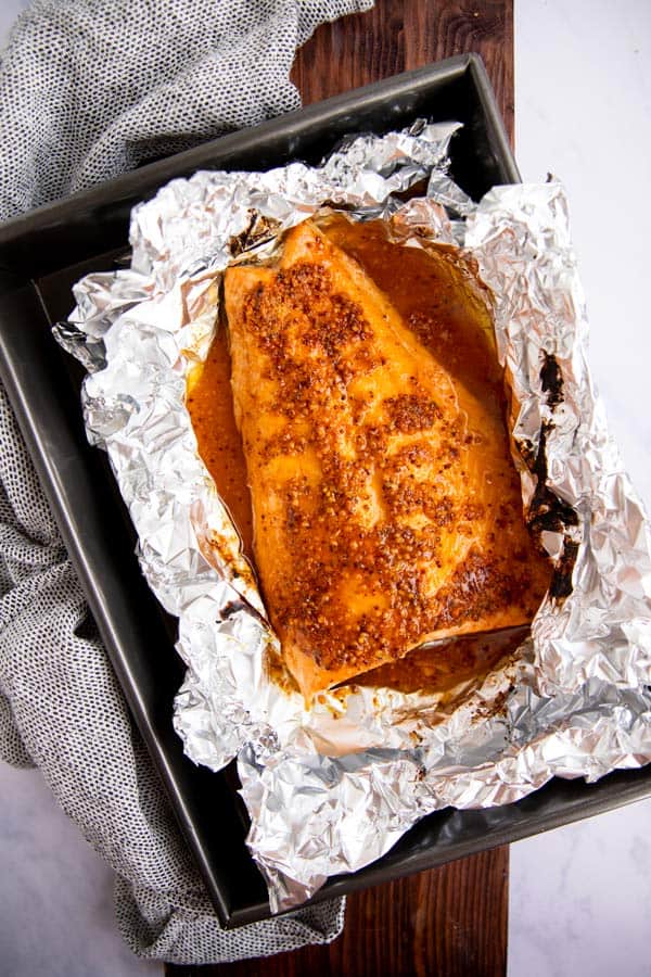 baking pan with foil and maple salmon