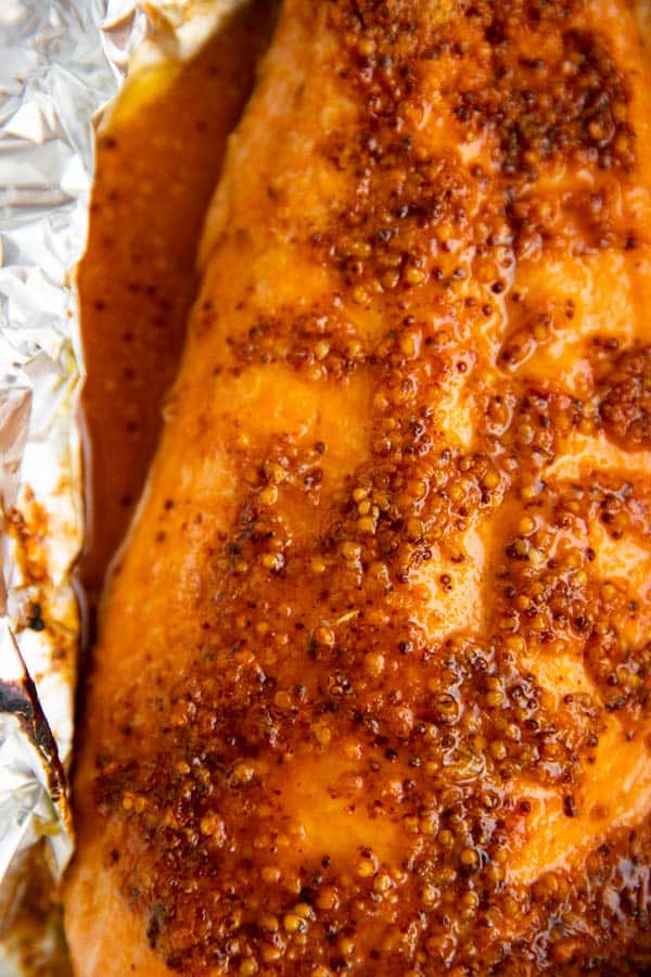 close up photo of baked salmon fillet in foil