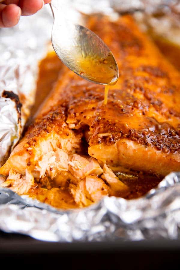 drizzling maple glaze over baked salmon fillet