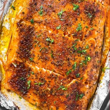 overhead view of oven baked salmon fillet cut into pieces