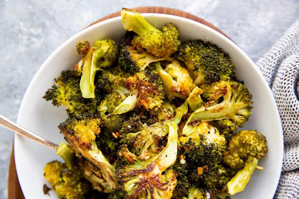 white plate filled with roasted broccoli