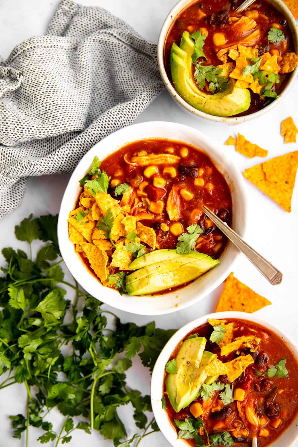 overhead view of three bowls with soup