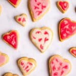 marble worktop covered in heart shaped cookies