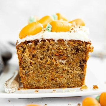 image of sliced carrot cake loaf on a white platter