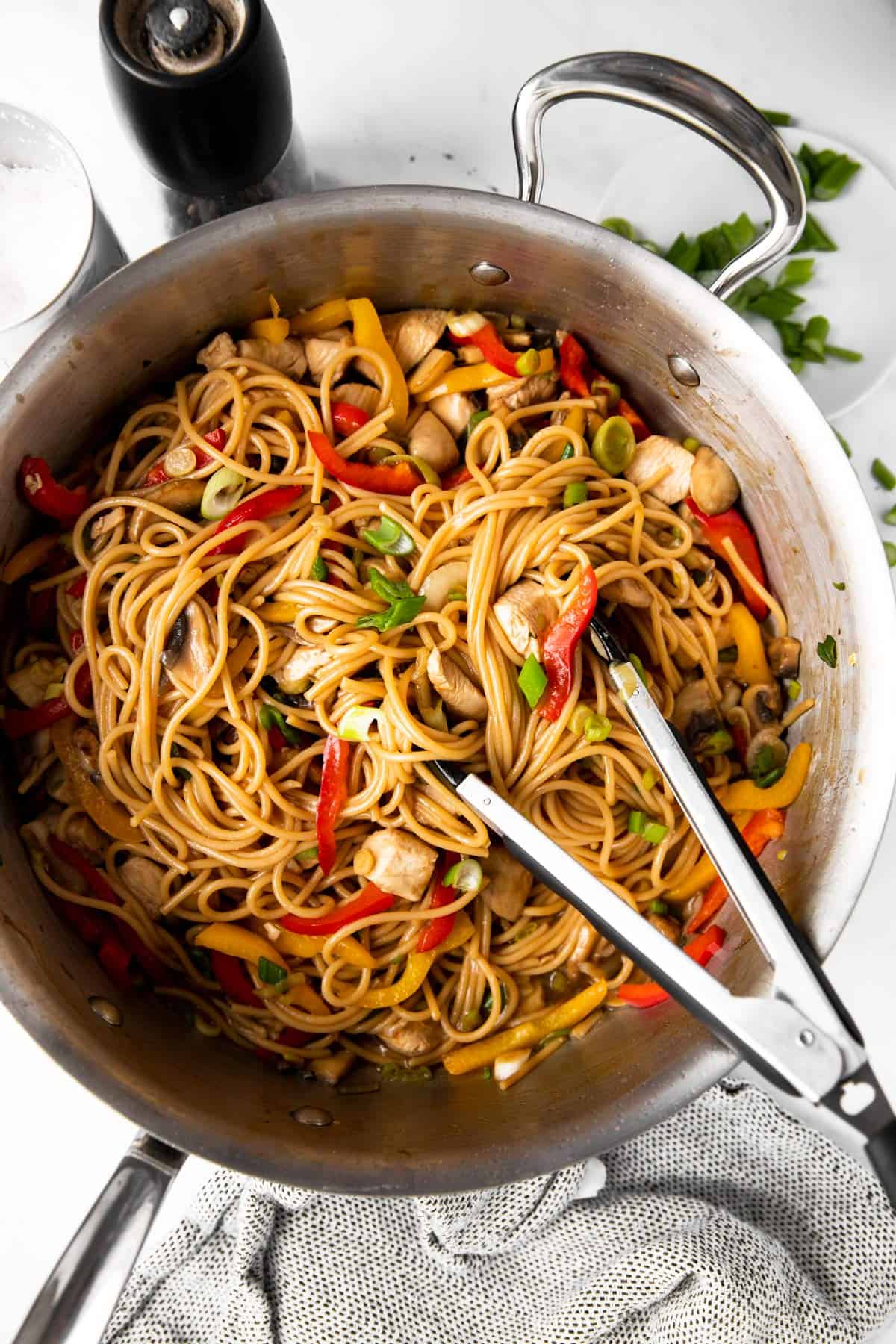 overhead photo of skillet filled with chicken lo mein