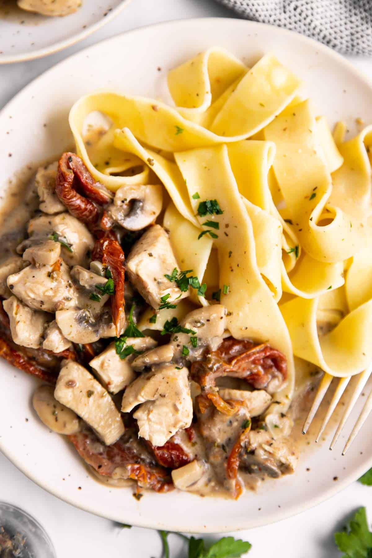 close up of plate with chicken and pasta