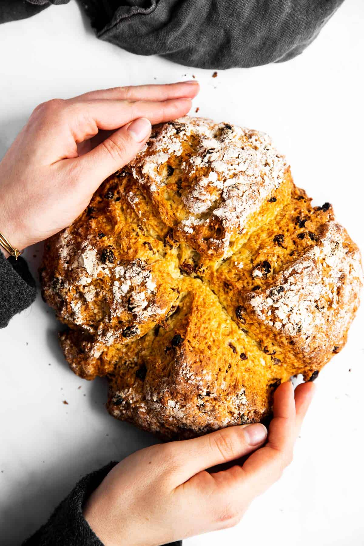 woman holding a loaf of Irish soda bread