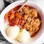 top down view of a bowl with rhubarb crisp and ice cream