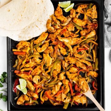 top down view on sheet pan with fajita chicken