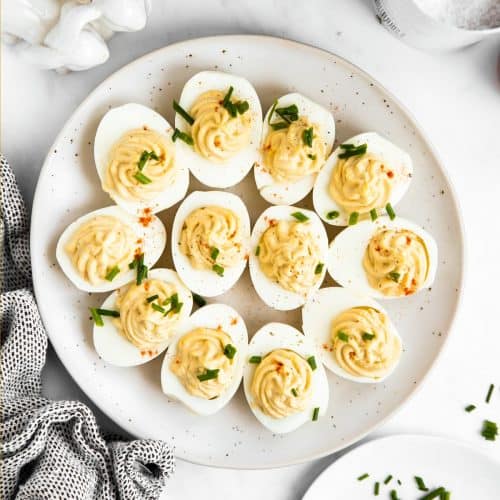 top down view on a plate filled with deviled eggs