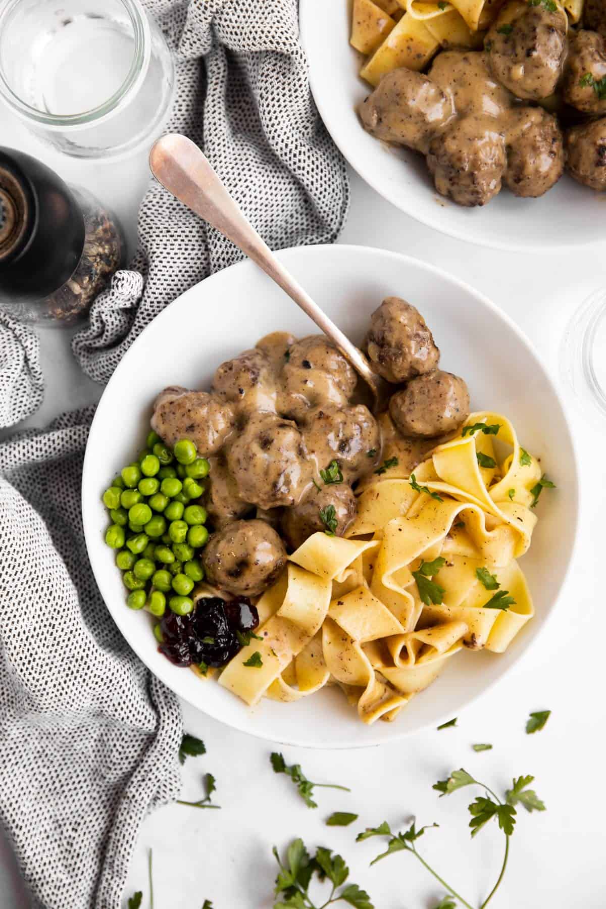 top down view on plate with meatballs in gravy over noodles