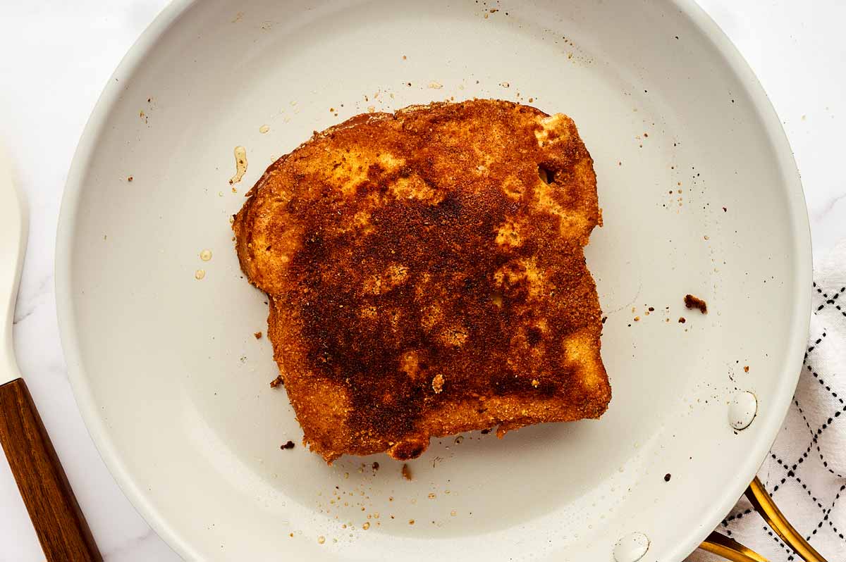 Fried French toast in skillet.