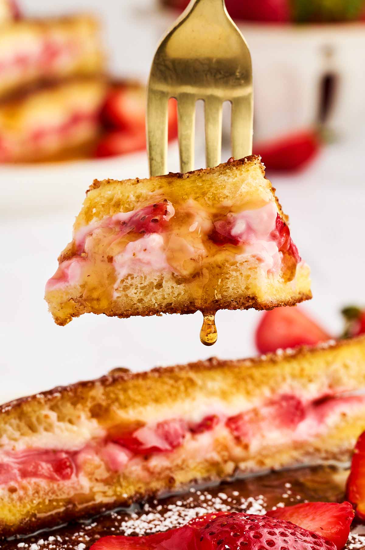 Piece of strawberry French toast on a fork.