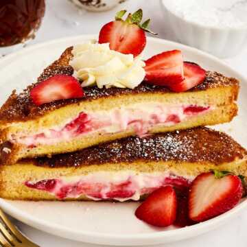 Stack of Strawberry Cream Cheese Stuffed French Toast slices.