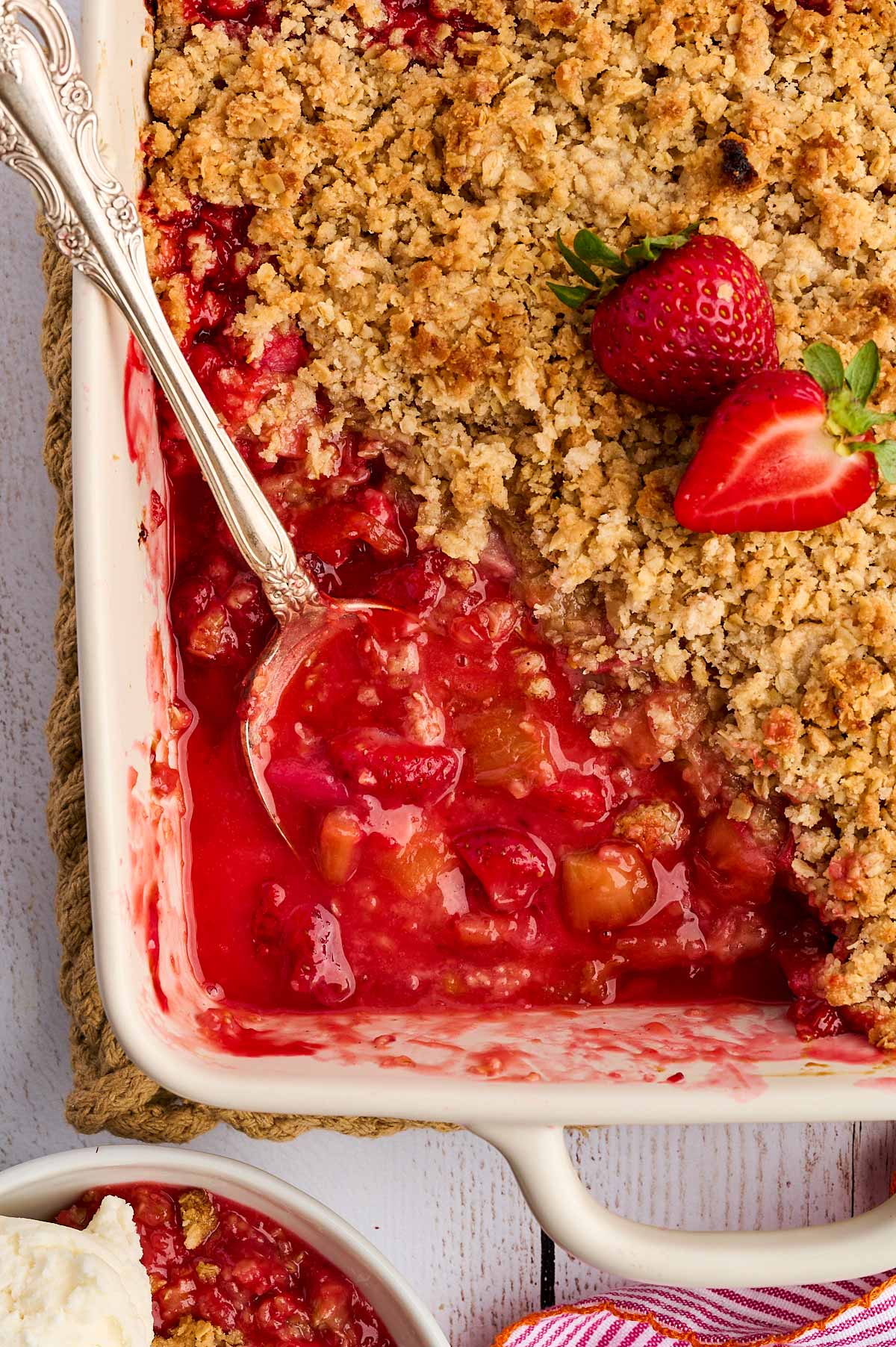 strawberry rhubarb crisp with serving spoon