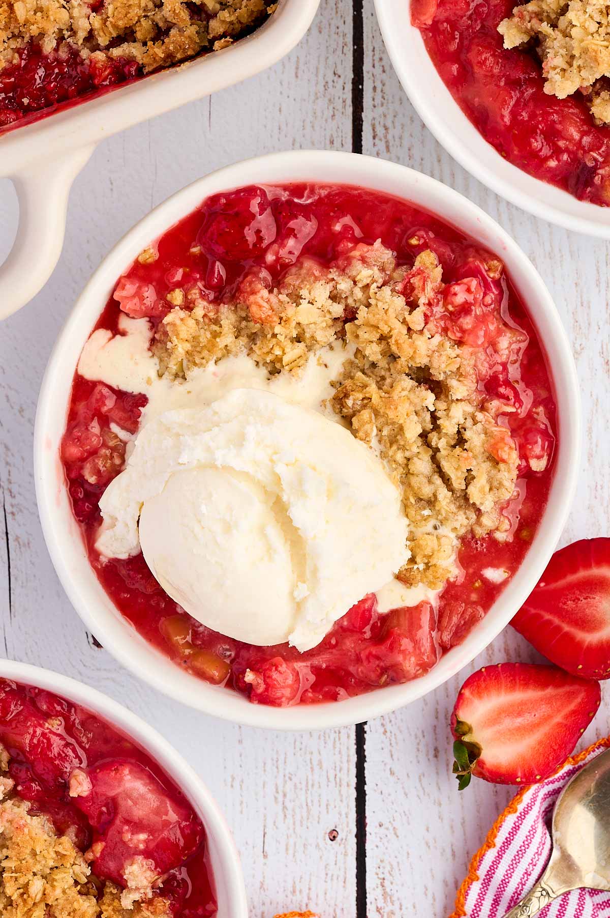 bowl of strawberry rhubarb crisp with ice cream