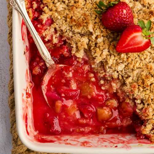 strawberry rhubarb crisp with serving spoon