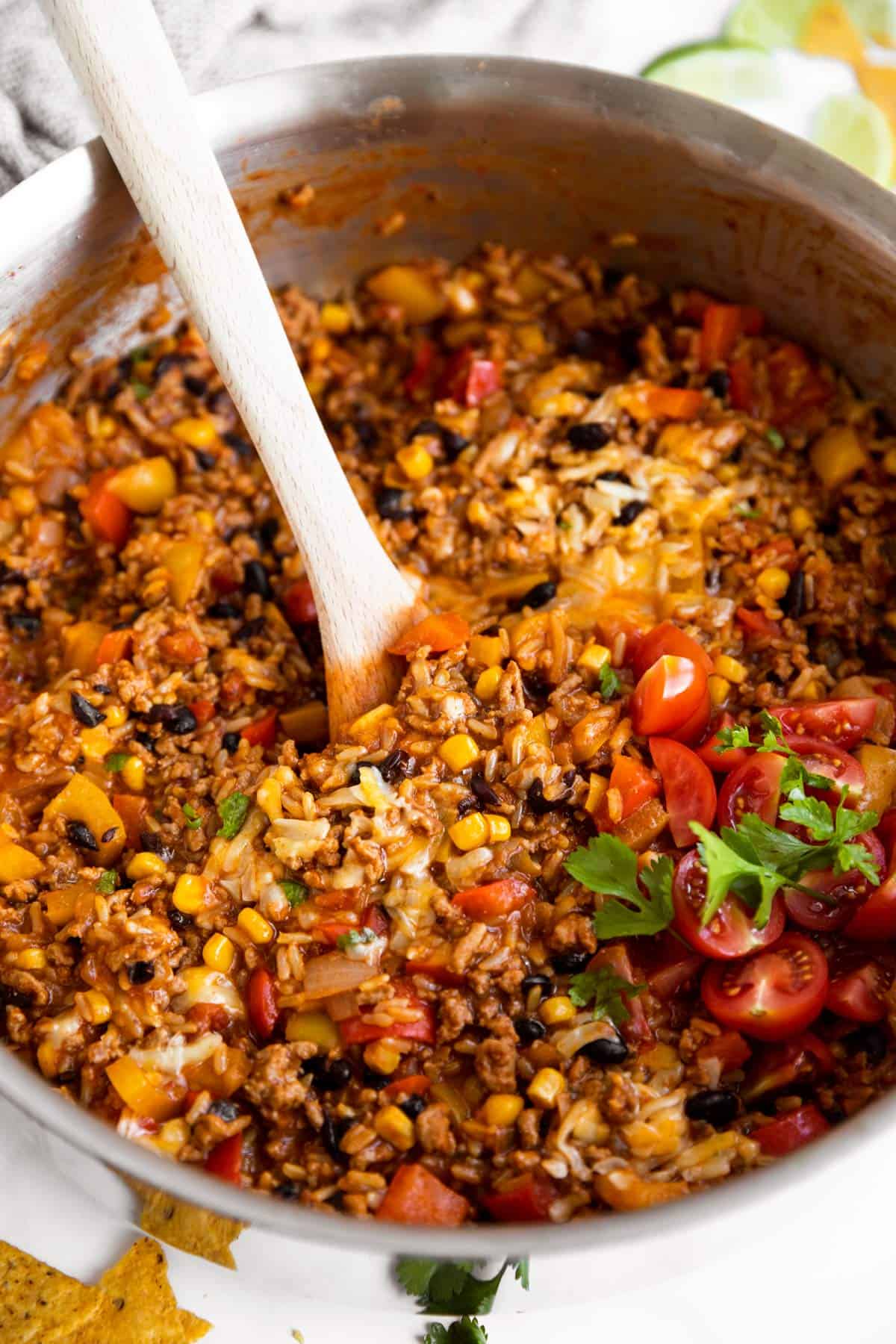 pan with rice, beef, fresh tomatoes and cilantro