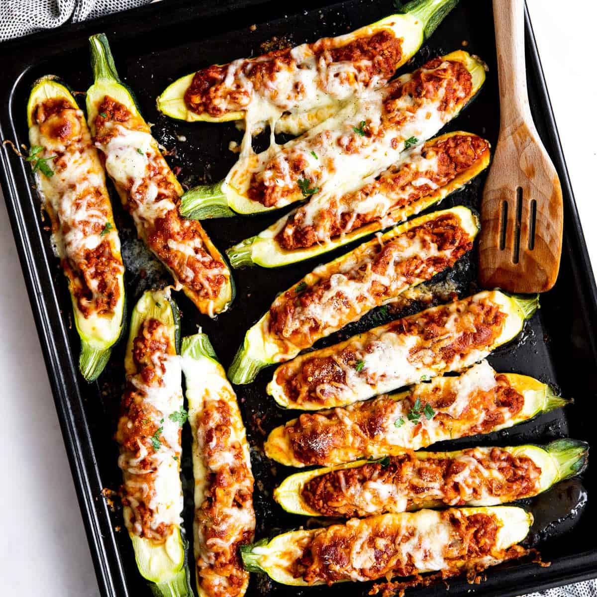 top down view on sheet pan with zucchini boats