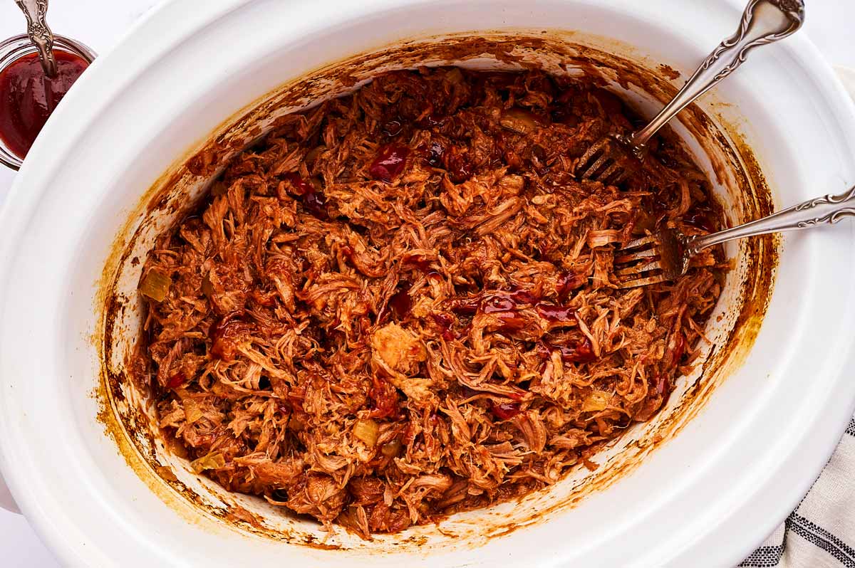 Pulled pork with BBQ sauce in crockpot.