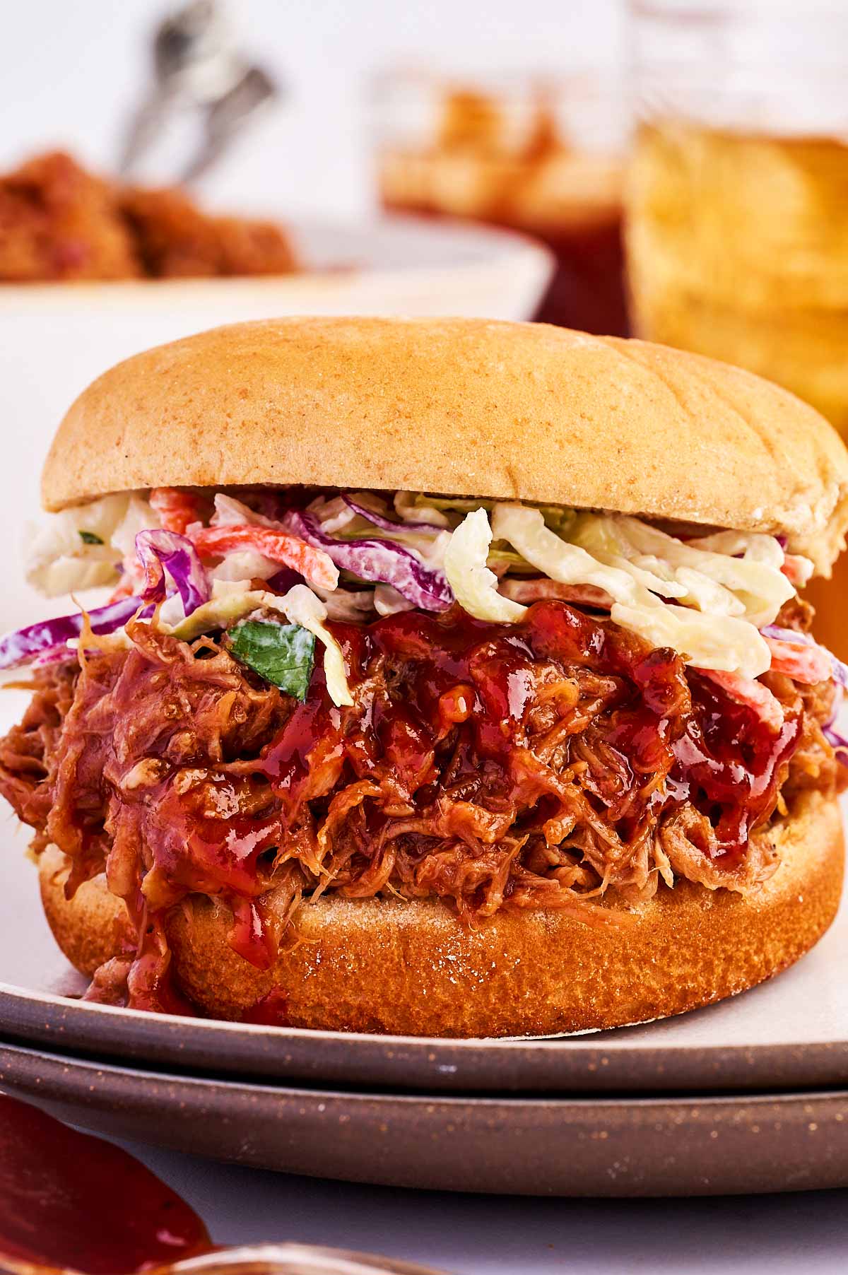 Pulled pork sandwich on a plate.