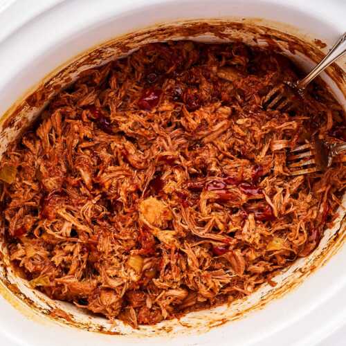 Pulled pork with BBQ sauce in crockpot.
