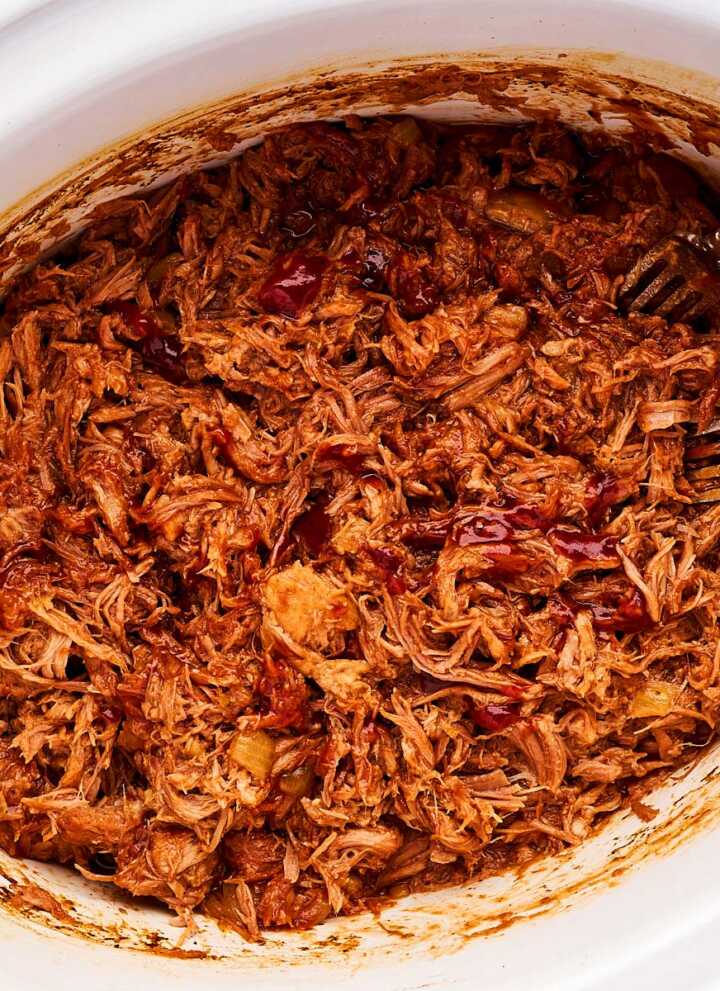 Pulled pork with BBQ sauce in crockpot.