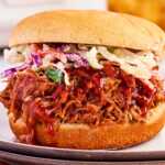 Pulled pork sandwich with coleslaw.