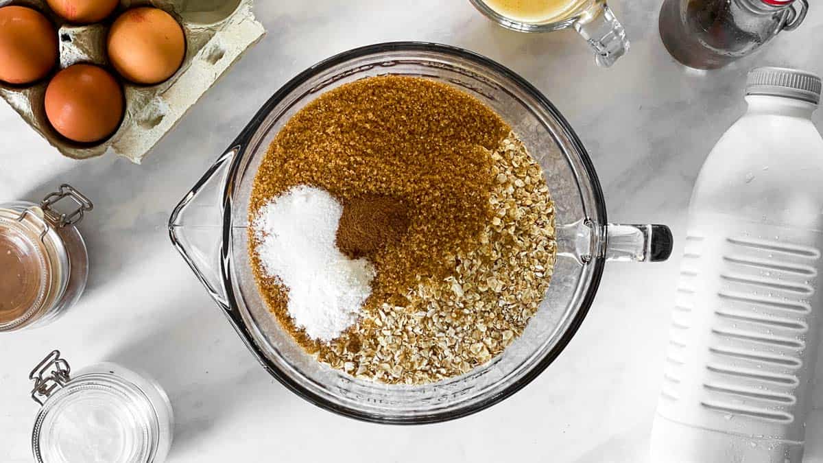 dry ingredients for baked oatmeal in a glass bowl