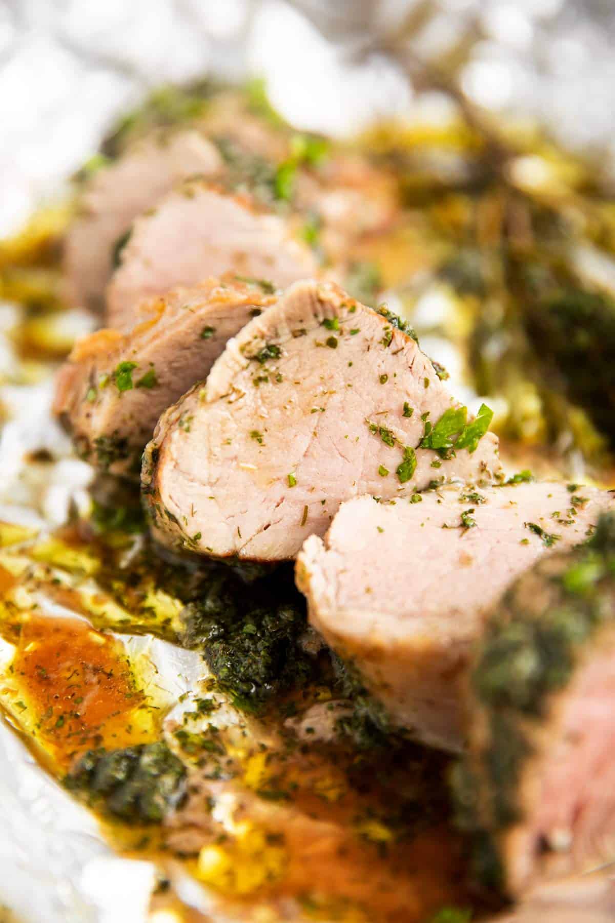 sliced pork tenderloin on foil