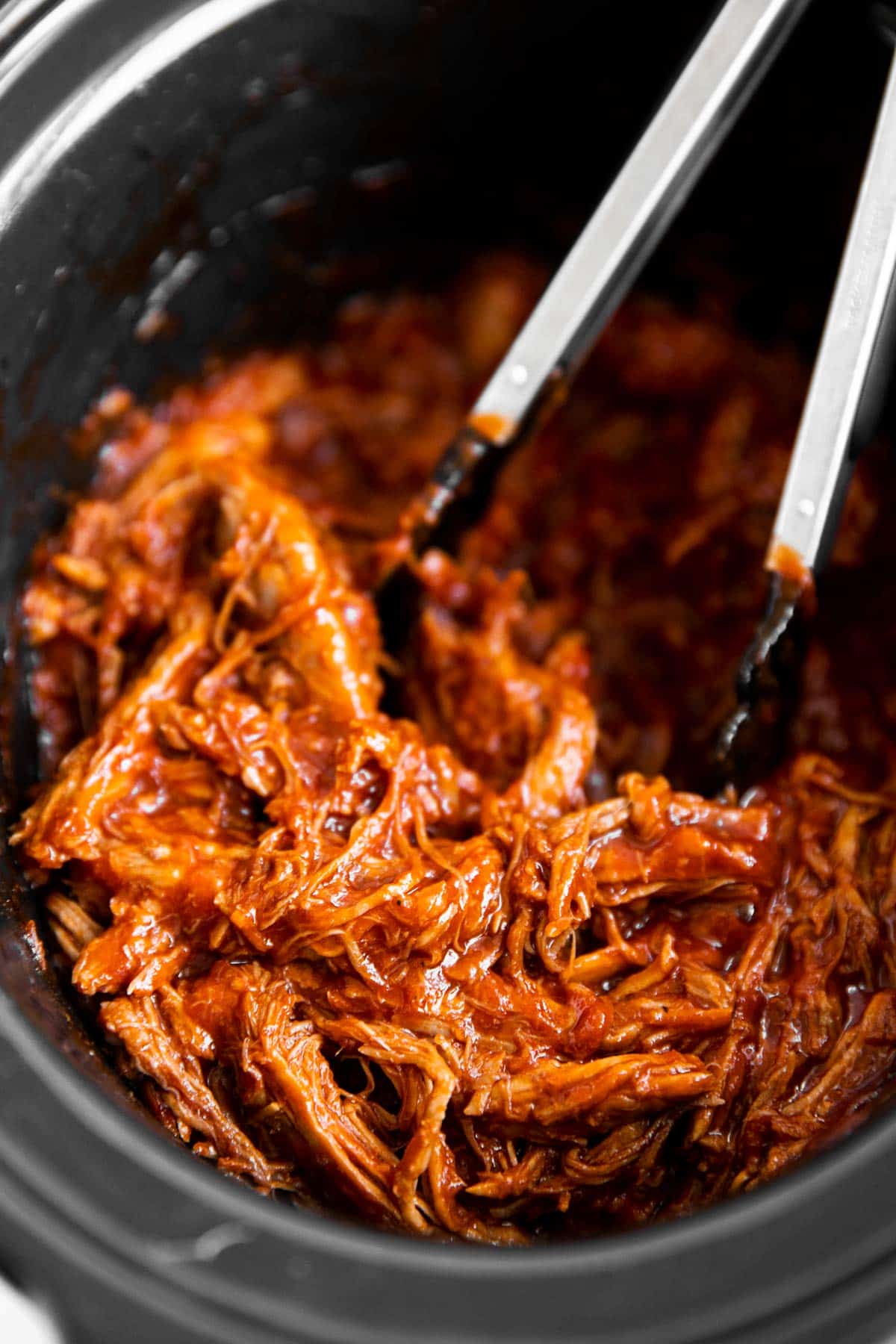 close up of pulled pork in crock