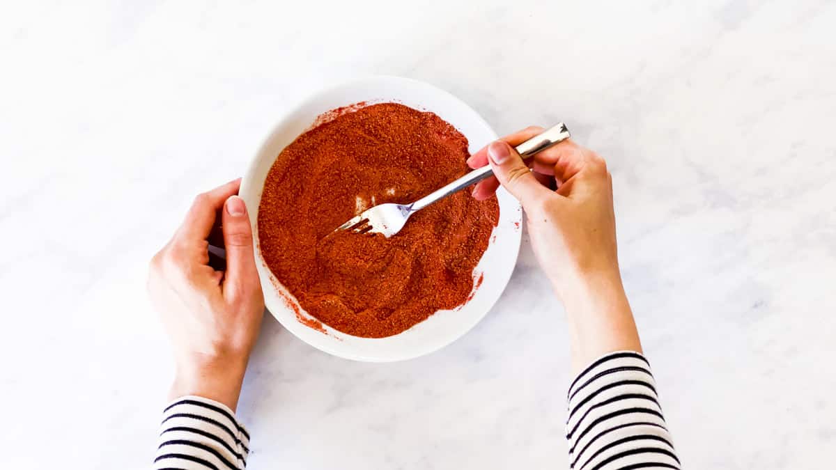 female hands combining BBQ rub