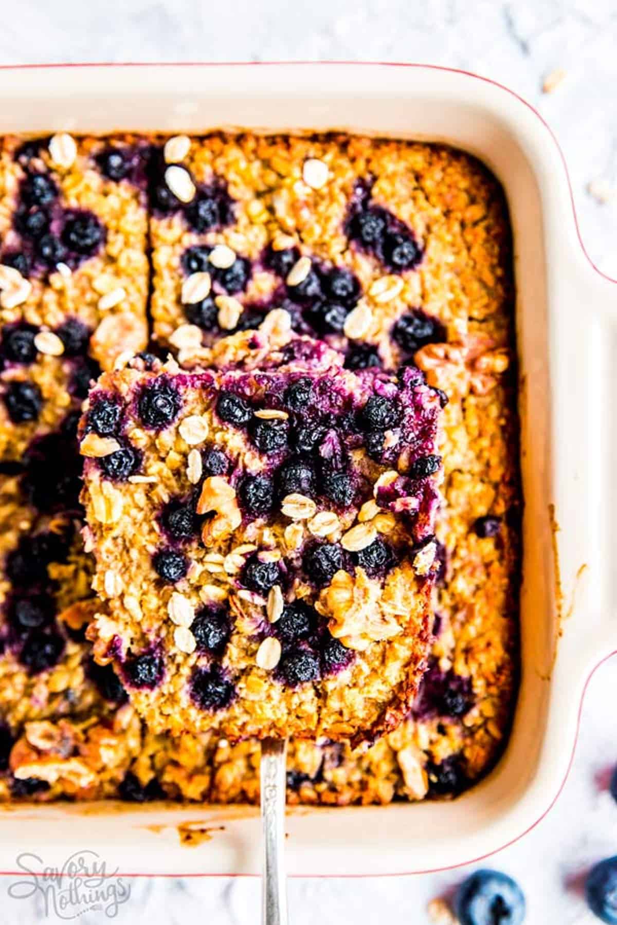 overhead view of blueberry baked oatmeal in white pan