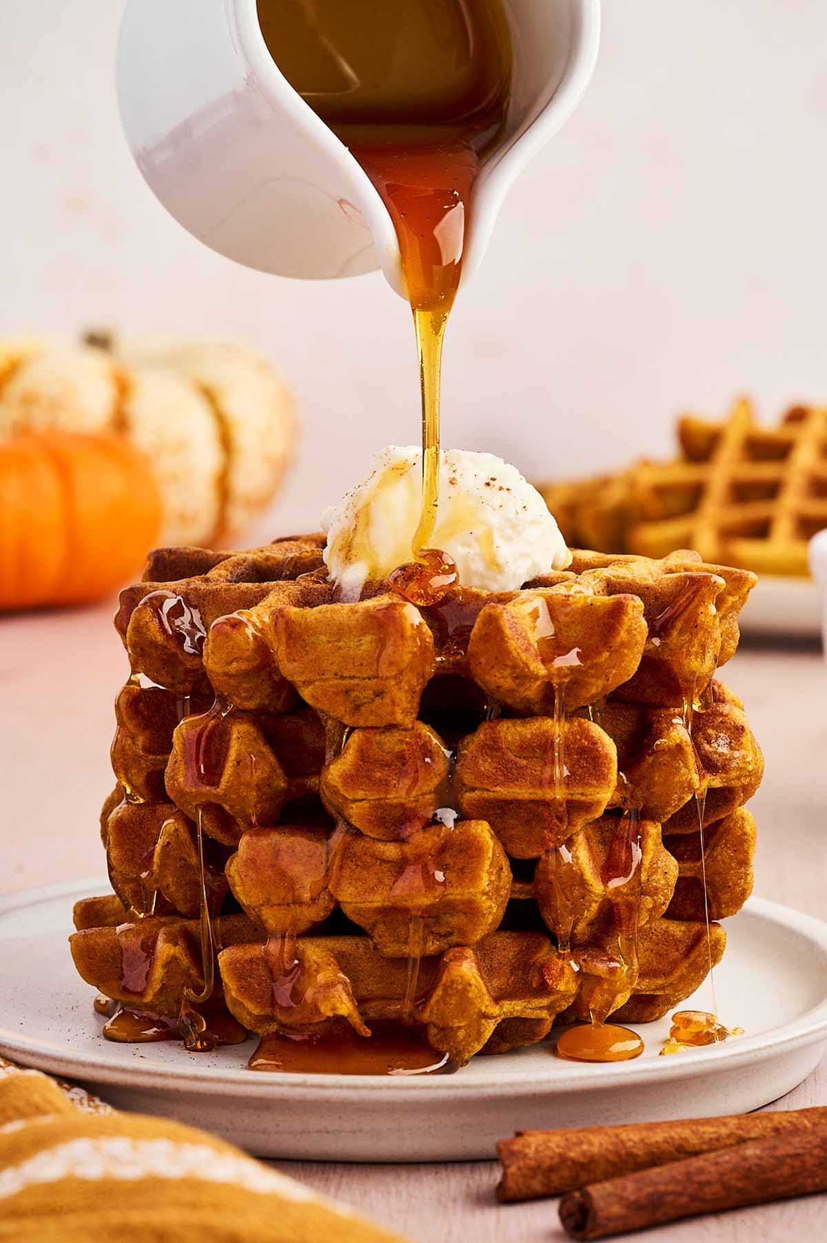 drizzling syrup over waffles