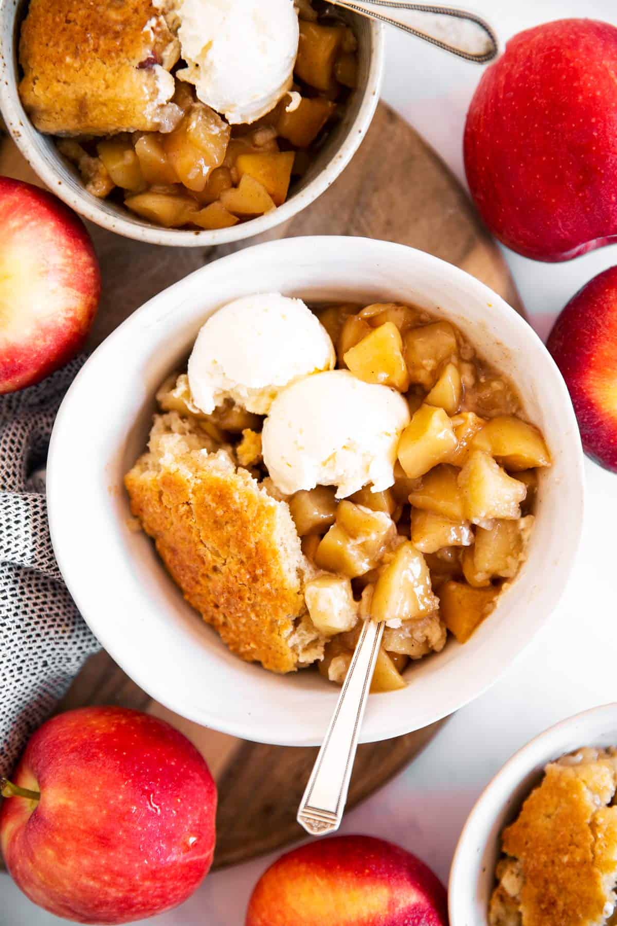 overhead view on three bowls with apple cobbler