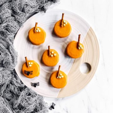 platter with pumpkin decorated Oreo cookies