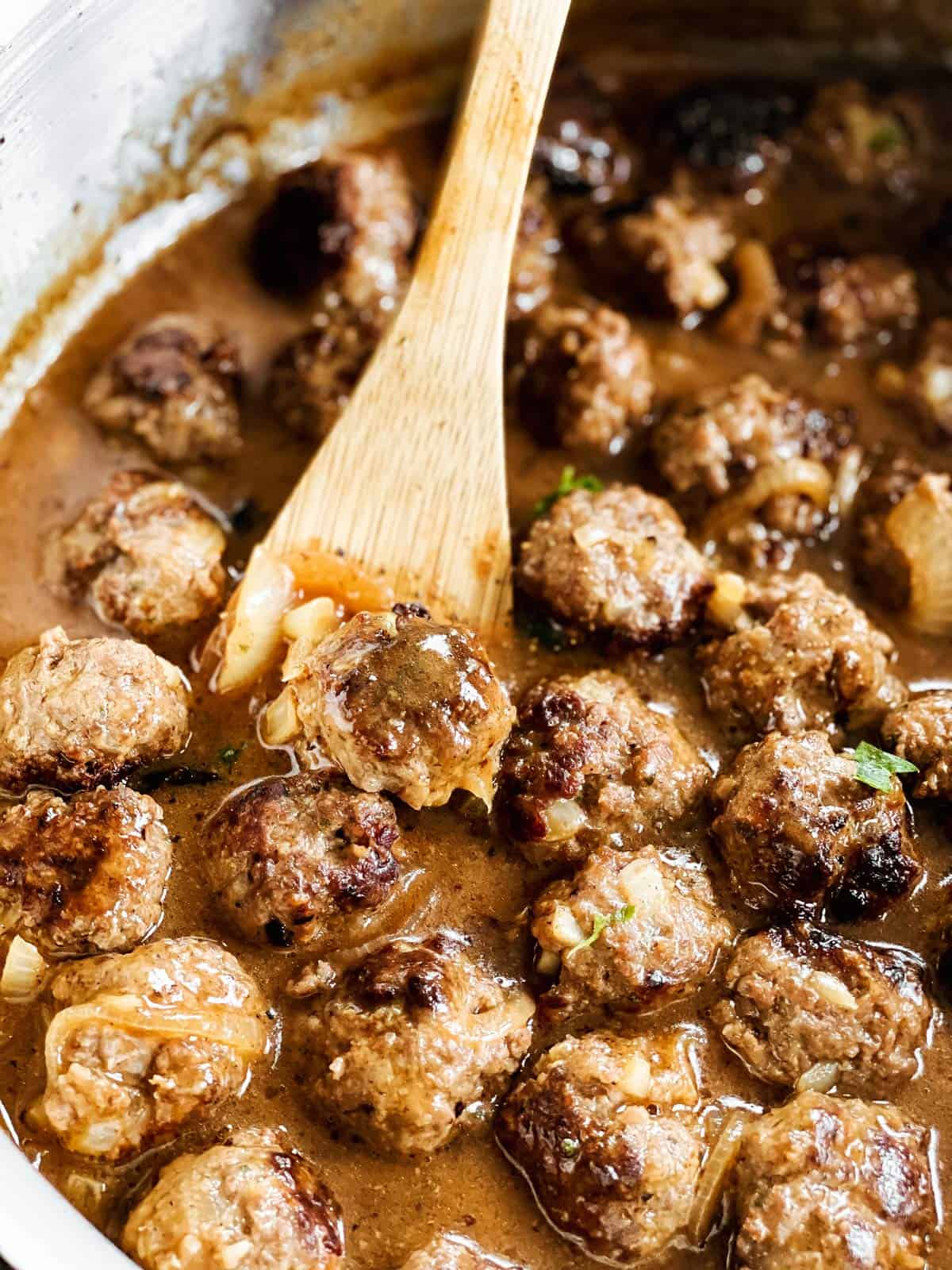 close up of meatballs smothered in gravy